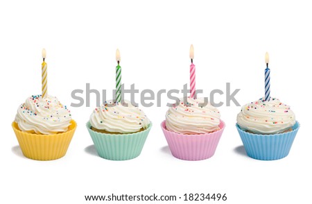 Four cupcakes with candle on white background Royalty-Free Stock Photo #18234496