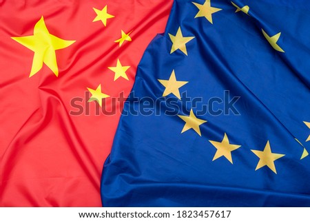 Real natural fabric flag of China or National Flag of the People's Republic of China and EU European Union flag as texture or background