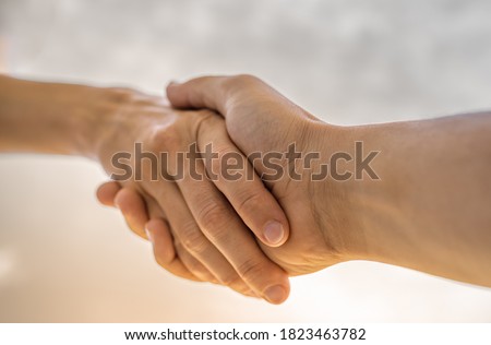 Reaching out to help a friend. Giving helping hand and support to someone in need concept.  Royalty-Free Stock Photo #1823463782