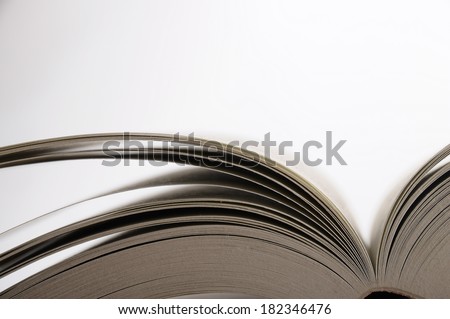 Open book pages on white and gray background