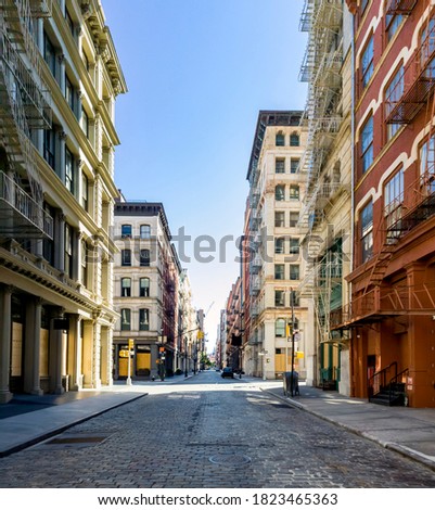The streets and sidewalks are empty with no people during the coronavirus pandemic lockdown in the SoHo neighborhood of New York City NYC 2020 Royalty-Free Stock Photo #1823465363