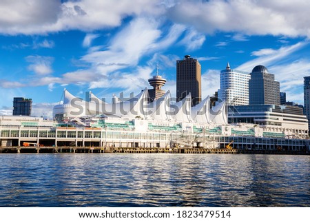 Canada Place and commercial buildings in Downtown Vancouver Viewed from water during Blue Sky Sunny Day. British Columbia, Canada. Urban Modern City Landmark
