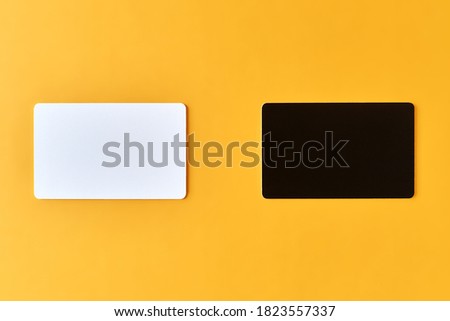 blank black and white cards on orange background