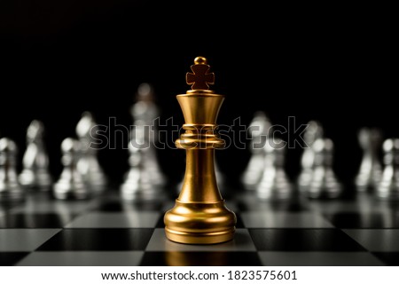 Golden King chess standing in front of other chess, Concept of a leader must have courage and challenge in the competition, leadership and business vision for a win in business games Royalty-Free Stock Photo #1823575601