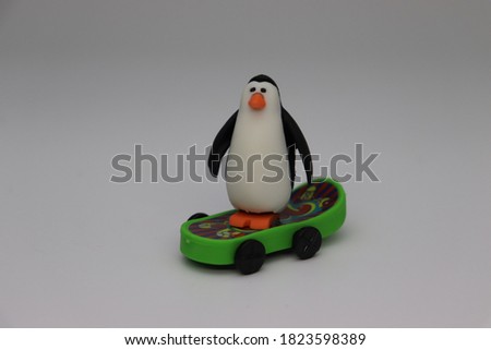 Photo of penguin small animal toys isolated on white background.