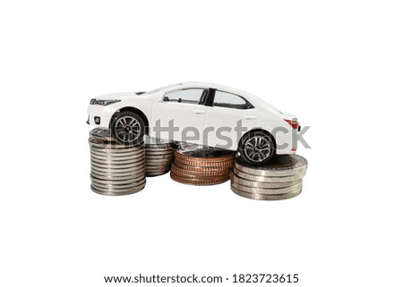 Coins stack with car, concept Saving money for car or trade car for cash