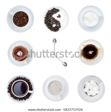 It's time to drink coffee. White cups and saucers with tea, sugar and coffee in the form of a clock face with spoons in the form of hour hands. White background, top view.