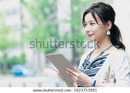 Japanese business woman with a tablet