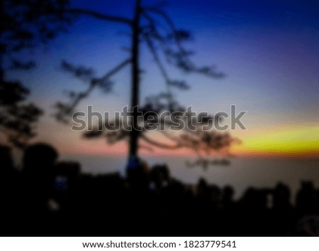 blur background of people waiting the sunset