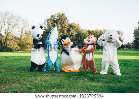 Group of mascots doing party. Concept about carnival, animals rights and lifestyle Royalty-Free Stock Photo #1823795594