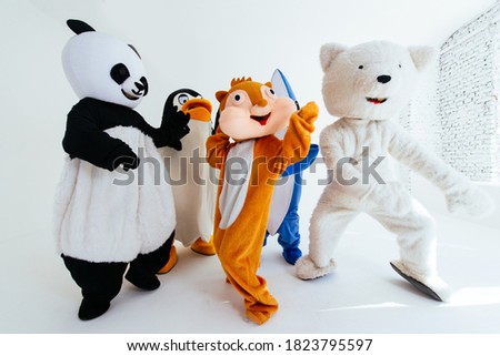 Group of mascots doing party. Concept about carnival, animals rights and lifestyle Royalty-Free Stock Photo #1823795597