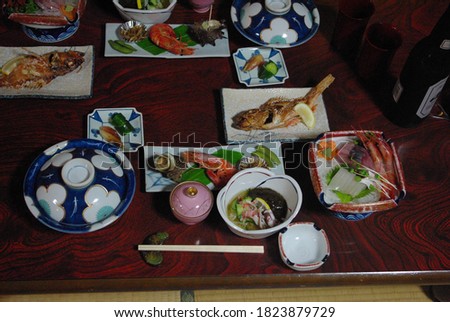 picture of a gourmet meal in a traditional japanese inn, on the coast of the sea of Japan
