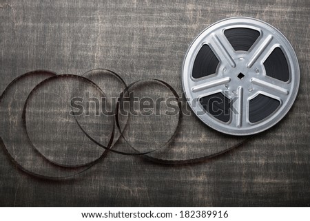 Motion picture film reel on the table