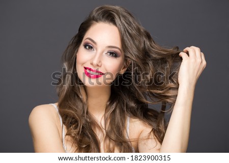 Portrait of a gorgeous brunette in elegant makeup.