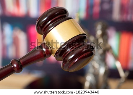 Judge's gavel and Lady Justice goddess of justice