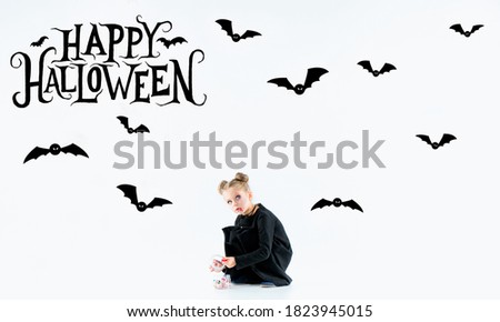 Little girl as vampire on white background, halloween time, flyer with copyspace. Black friday, cyber monday, sales, autumn concept. Flyer for your ad. Halloween mood, october time, scary and stylish.