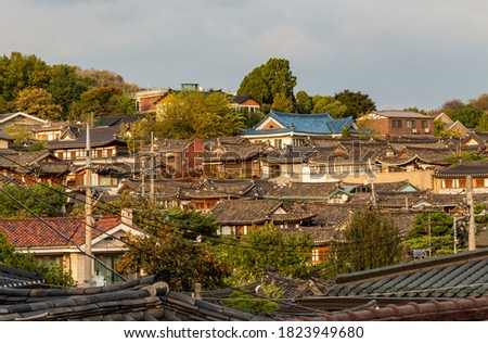 The Korean architechture in the roof tops of Bukchon Hanok Village in Seoul, South Korea. Translation "Bukchon Hanok"