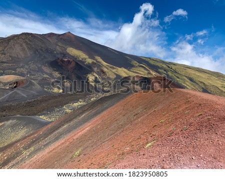 Stunning view of volcano mountain Etna landscape with colorful volcanic stones on Sicily, Italy