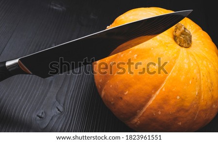 A pumpkin cooked to make a halloween lantern, and a sharp knife for making a face, Jack Lantern, Halloween attribute