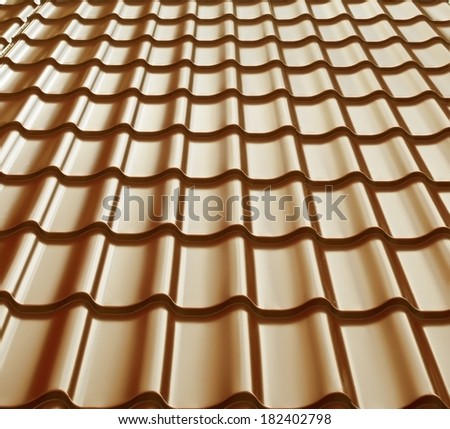 Steel roof painted in golden color. Golden roof.