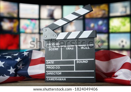 Clapperboard against the background of the USA flag. American cinema