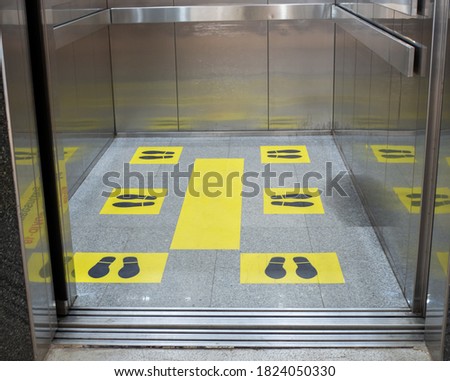 Marks for standing distance in passenger elevators To stand apart During the coronavirus outbreak. Concept of social distance.