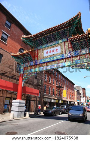 View of Philadelphia Chinatown and Chinatown gate in Philadelphia, Pennsylvania, USA. Translation on gate text "Philadelphia Chinatown".