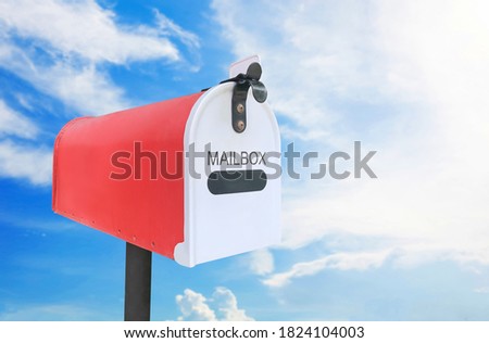Red mail box outdoor on sky.