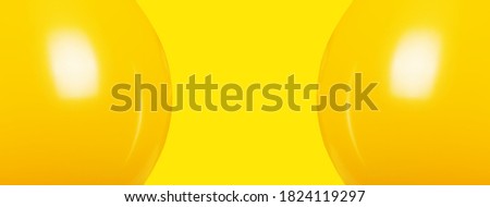 festive inflatable balloons over yellow  background, panoramic image