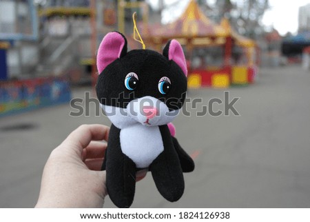 A small soft toy black and white kitten. 