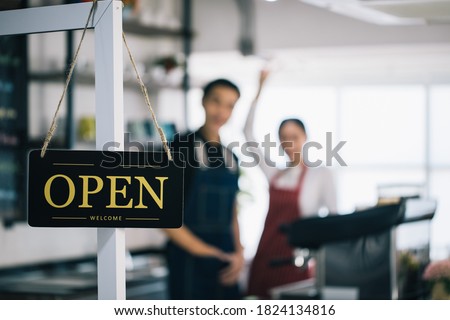 A business sign that says 'Open/welcome' on Cafe and coffee shop or Restaurant window. Vintage tone