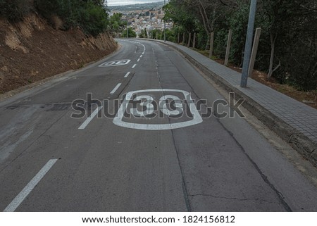 Speed limit on a mountain road. Stock photo