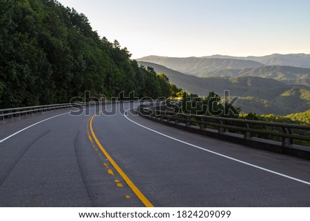 Exploring The Foothills Parkway. Winding mountain road along the Great Smoky Mountains Foothills Parkway in Wears Valley, Tennessee, USA. Royalty-Free Stock Photo #1824209099