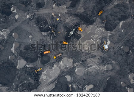 Coal mining an open pit extractive industry, top view aerial. Royalty-Free Stock Photo #1824209189