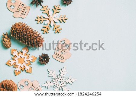 evergreen tree and red christmas decorations with cones frame isolated on white background