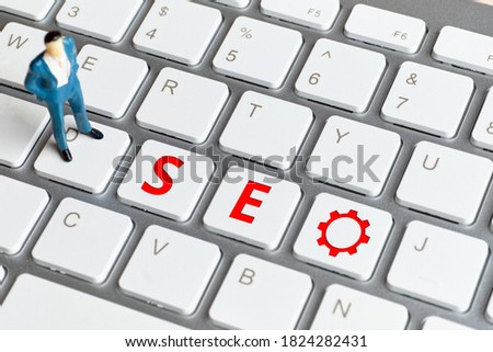 SEO worker concept from abstract persona on keyboard.