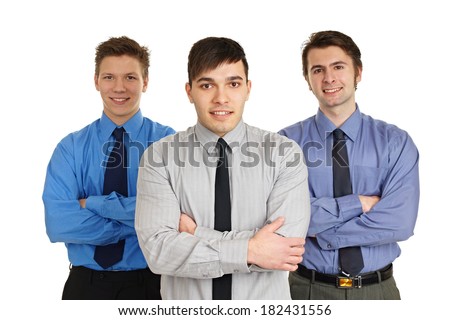 Portrait of three young business people standing