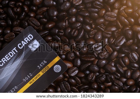  credit card placed on a coffee bean
