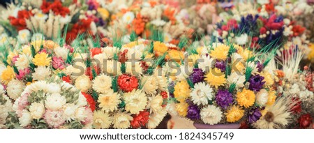 Vintage photo, Colorful flowers with decoration made of ears of wheat or rye