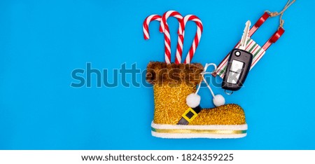 Car Key As Christmas New Year Presents On Blue Background Banner With Empty Space For Design. Flat Lay, Top View.