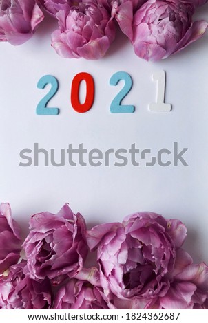 2021 wallpaper for flowers shop. Purple tulips and 2021 wooden date 