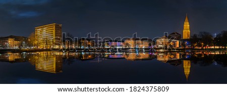 Kiel skyline at night. View from the water of the Kleine Kiel. Royalty-Free Stock Photo #1824375809