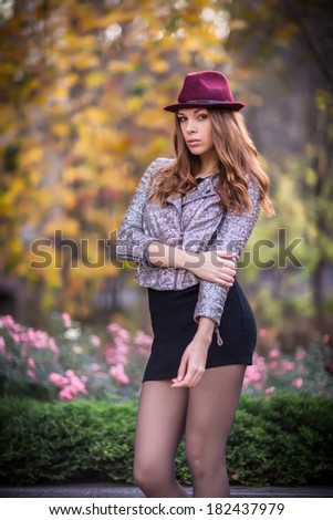 Style redhead girl at beautiful autumn alley