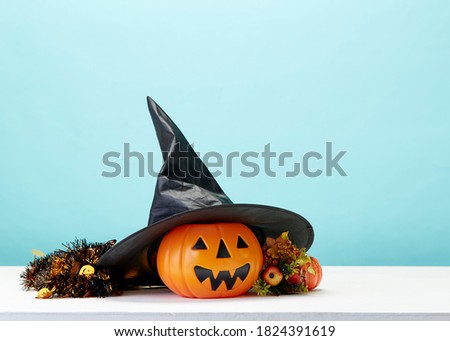 Happy Halloween holiday pumpkin jack o lantern party decorations  on a blue background Copy space for text