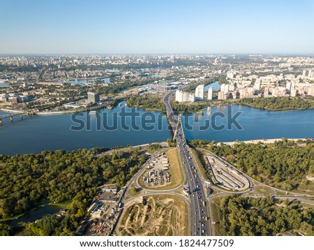Aerial drone view. Automobile North Bridge in Kiev across the Dnieper River. Sunny day.