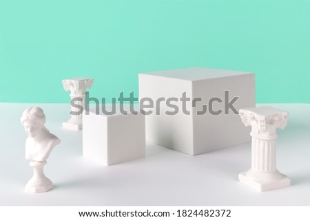 Abstract background mock up with podium for product display and gypsum ancient sculpture. Blank product stand in minimal slyle on turquoise background. Royalty-Free Stock Photo #1824482372