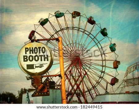 aged and worn vintage photo of photo booth sign with ferris wheel                             