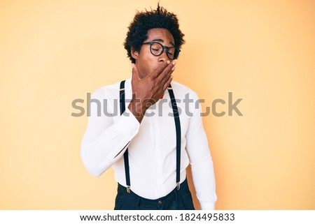 Handsome african american man with afro hair wearing hipster elegant look bored yawning tired covering mouth with hand. restless and sleepiness. 