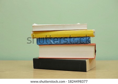 Stack of Books on green background