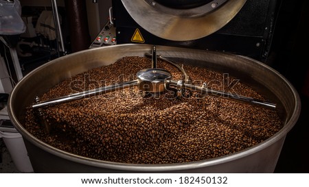 Mixing roasted coffee Royalty-Free Stock Photo #182450132